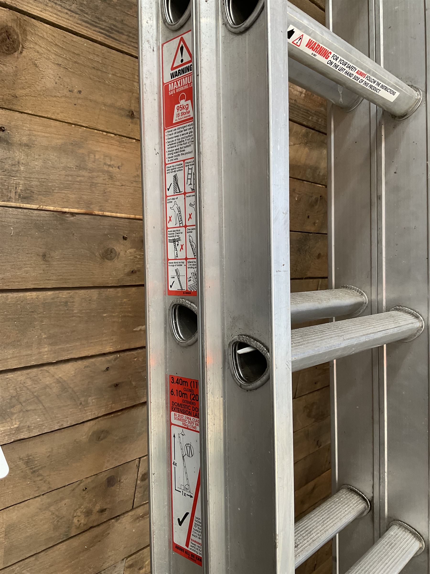 Abru pair of aluminium extendin ladders, 3.4m - 6.1m