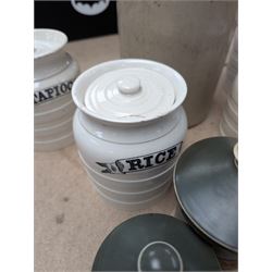 19th century sage green apothecary jars with gilt labels, four white ceramic kitchen jars and a stoneware flaggon marked Wheat Wine