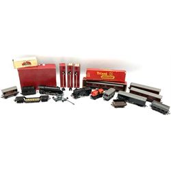 Trix Twin Railway - Hunt Class 4-4-0 locomotive and tender 'Pytchley' No.62750, boxed; 0-4-0 tank locomotive with plastic body No.67611; three passenger coaches (one boxed); six goods wagons; three boxed Yard Lamps etc; and Tri-ang Track Cleaning Car, boxed