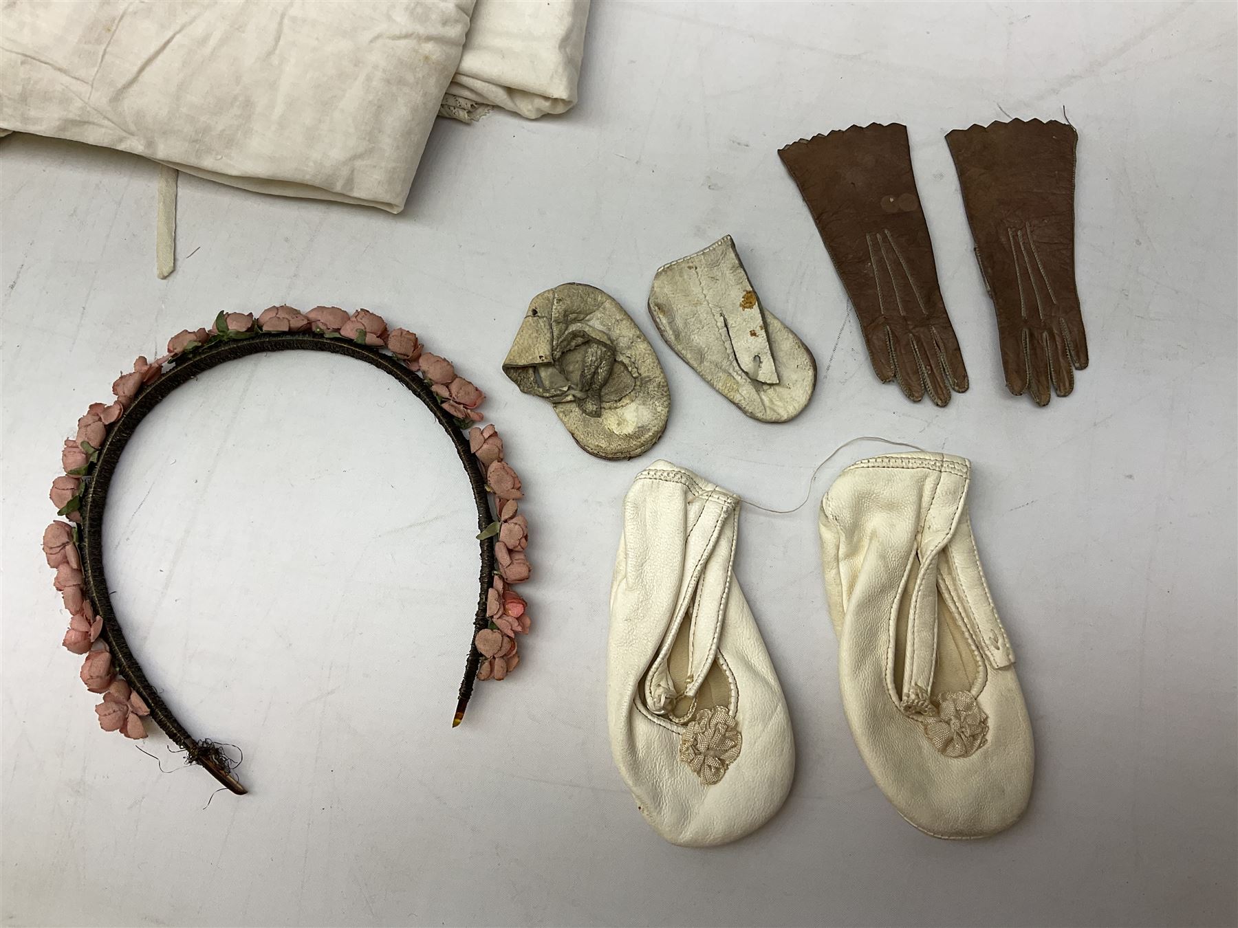 Late 18th century sampler worked with the alphabet above verses in red, by Mary Birkett aged 10 November 16th 1792, H33.5cm W34.5cm, together with another sampler worked with the alphabet above Proverbs 14:23, by Mary Anne Hainworth, Chesham, date unknown (--83), both in glazed frames, together with a quantity of Victorian and later dolls clothes to include lace examples