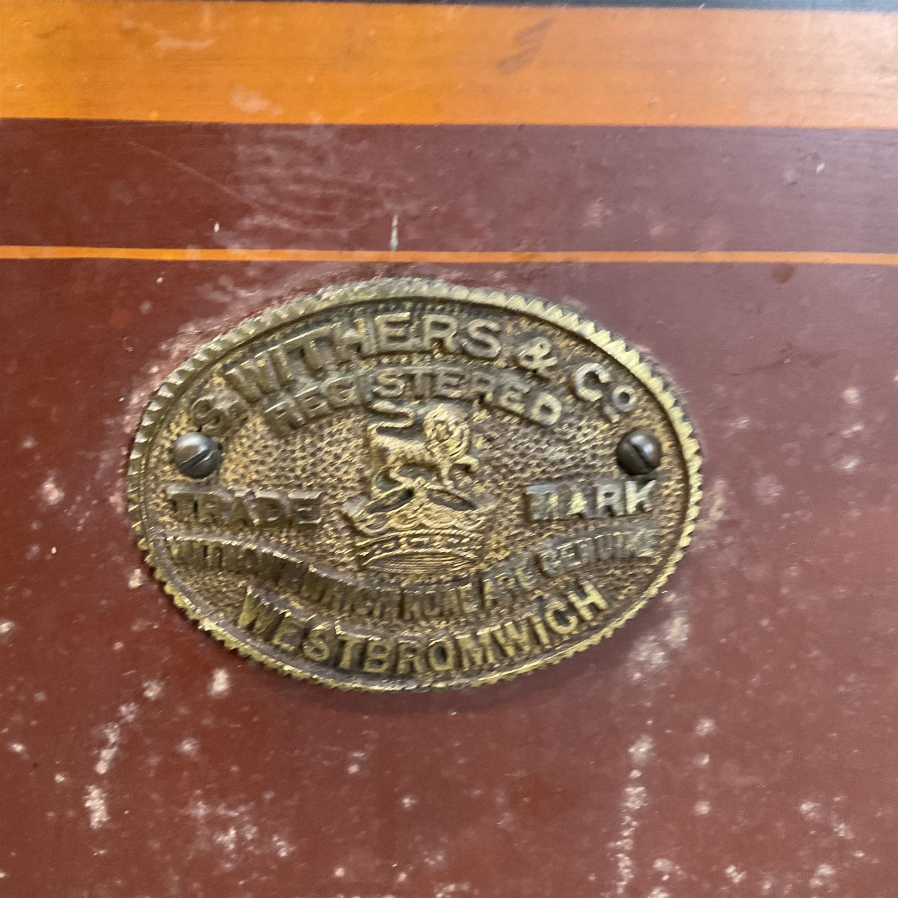 Samuel Withers & Co of West Bromwich - Victorian cast iron safe, the brass handle modelled as a clenched fist, painted in red, orange and black, with key. Ground floor delivery only, no steps.