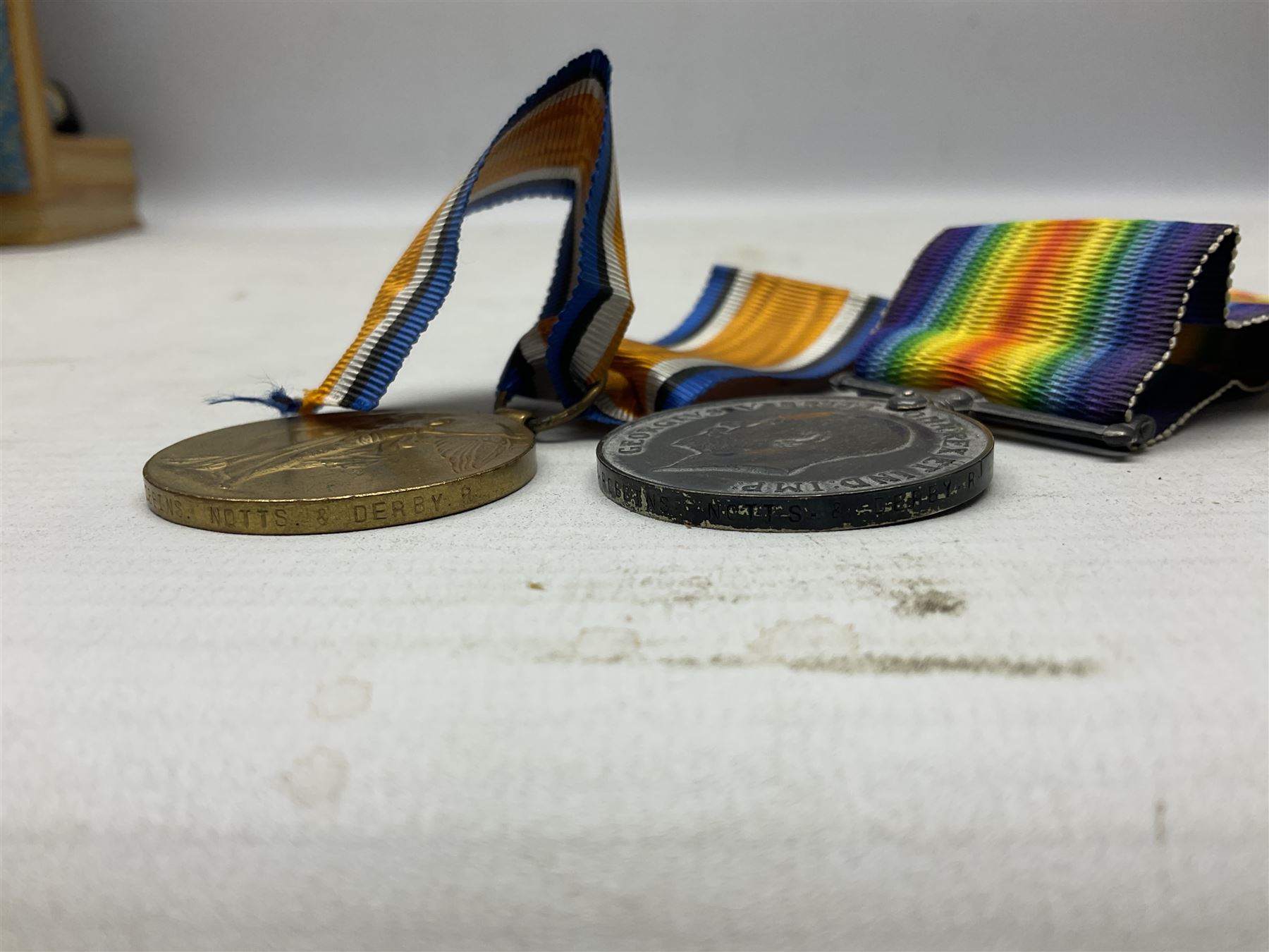 Pair of WWI medals, comprising British War medal and Victory medal, both with ribbons