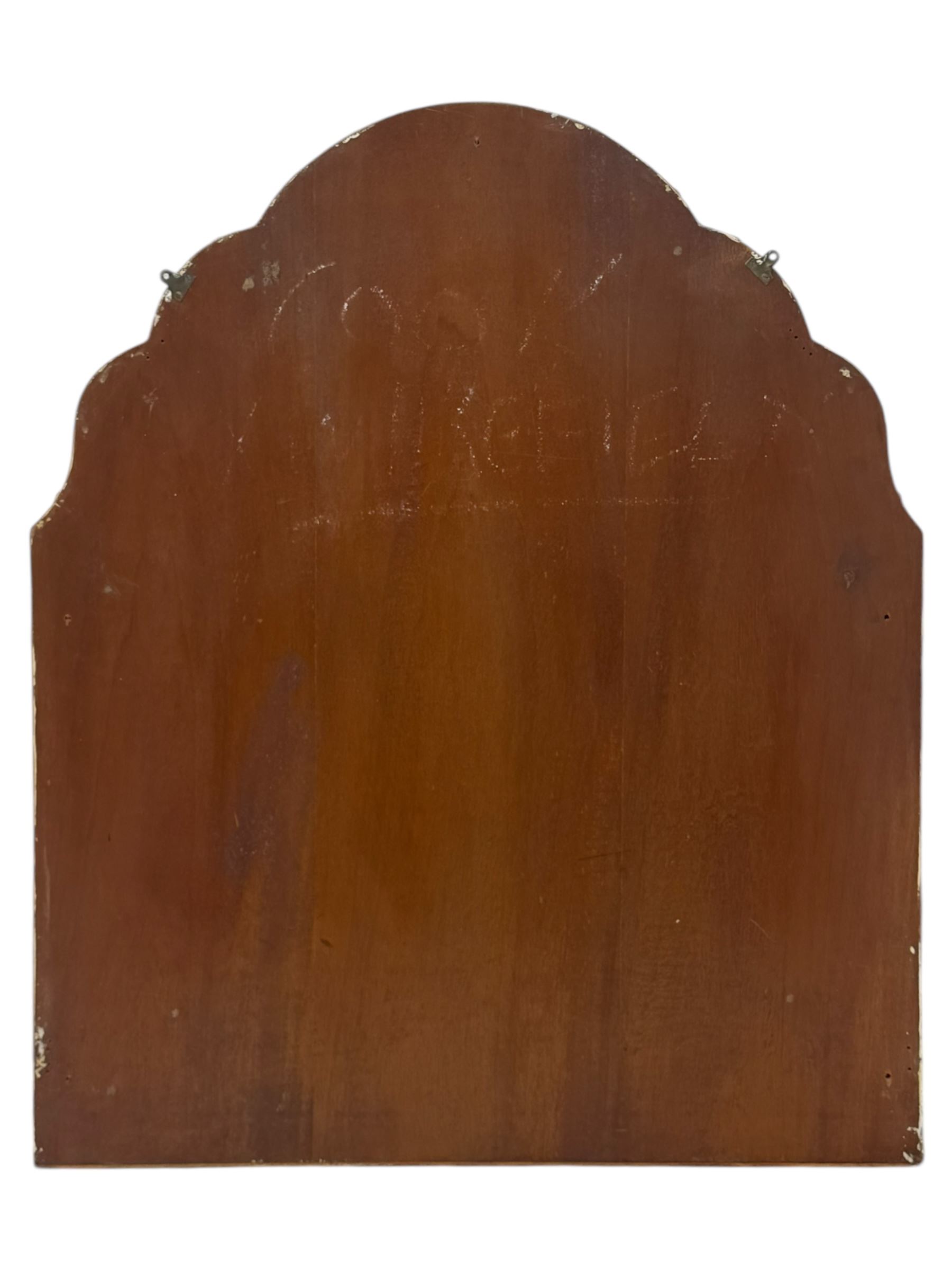 Frameless art deco mirror, scalloped copper tinted border central fan motif, bevelled edges with decorative screw caps