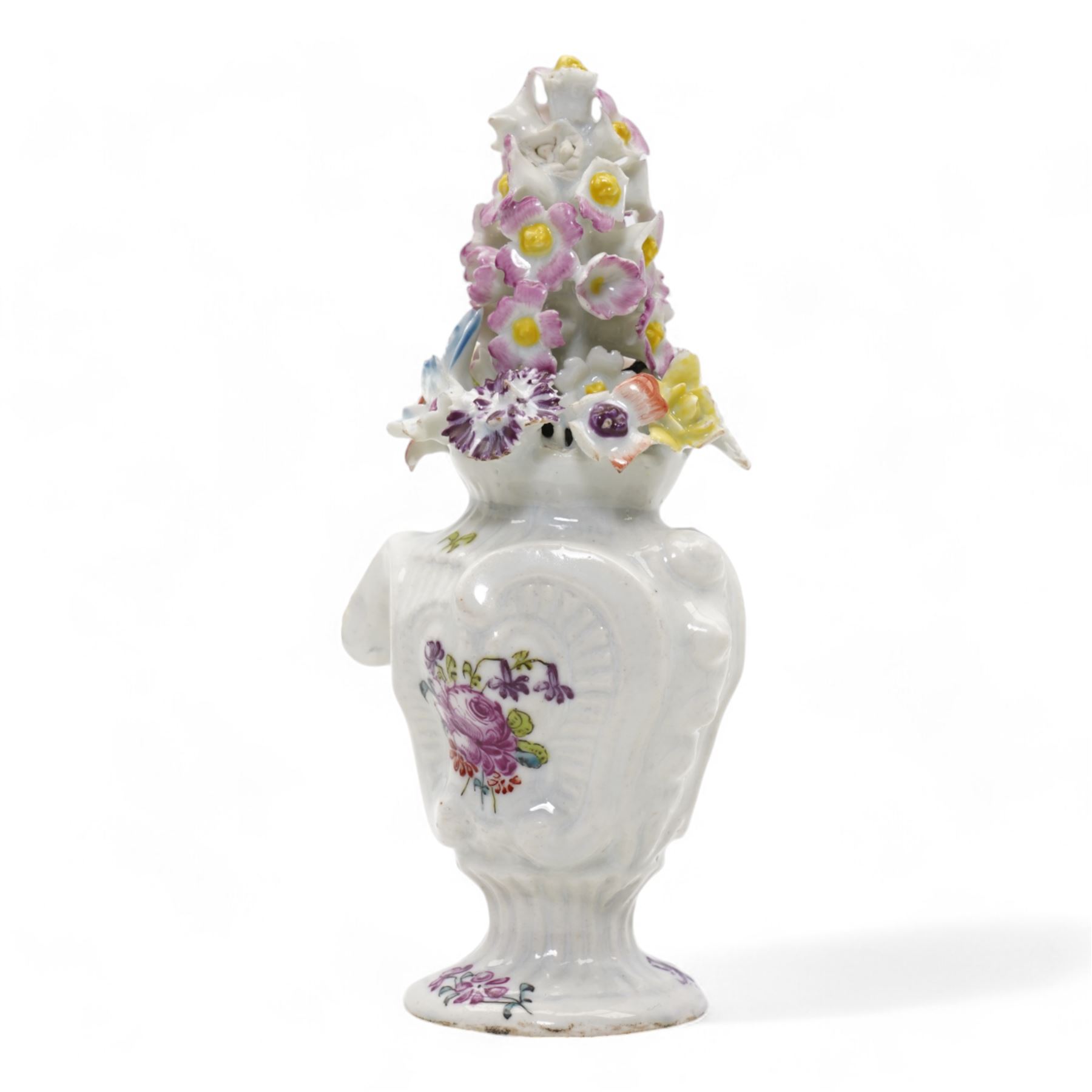 Longton Hall floral table ornament, circa 1755, the moulded rococo base painted with floral sprays and sprigs, below a floral encrusted arrangement, unmarked, H14.5cm 
