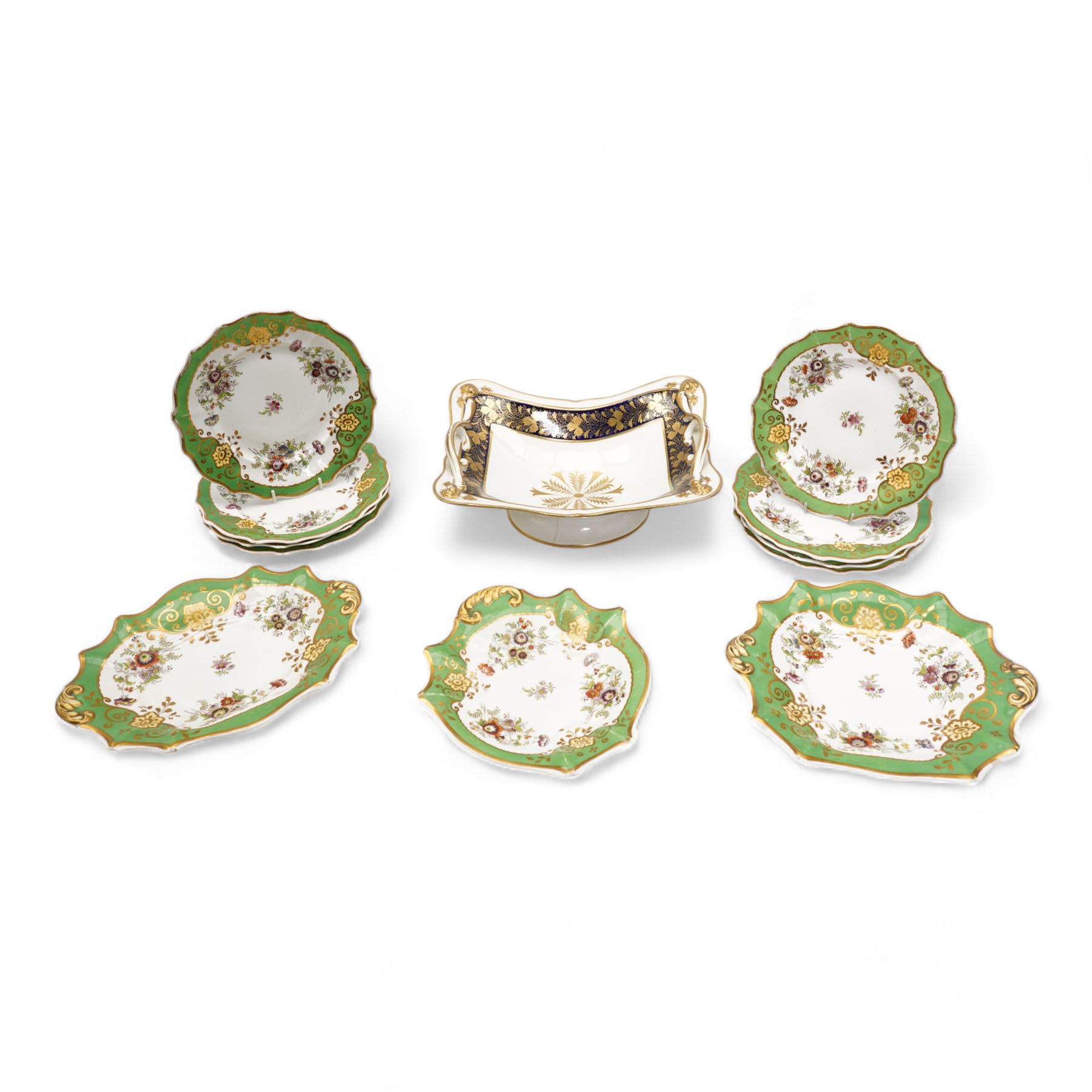 Large early 19th century Derby porcelain dessert basket, of rectangular twin-handled form, with cobalt blue and gilt decoration, painted marks beneath, L29cm together with a 19th century porcelain dessert service, decorated with floral sprays within a green and gilt border, comprising eight plates and three serving dishes, pattern no. 701/1