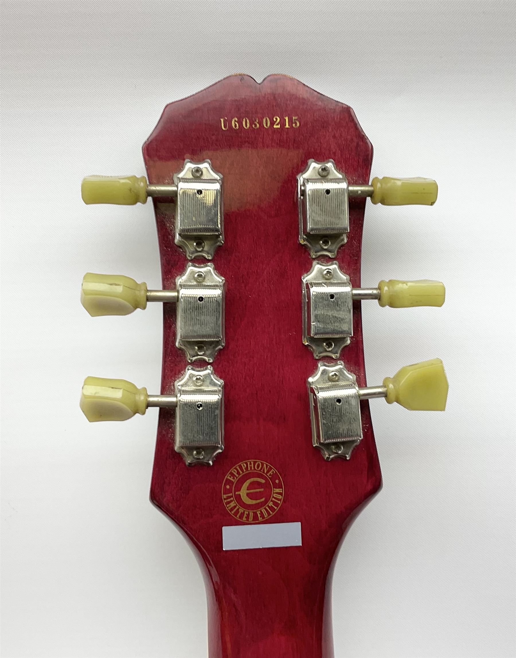 1980s Les Paul Epiphone limited edition cut-away electric guitar by Gibson, the burgundy coloured body with two pick-ups, volume and tone knobs and scratch plate, original tuning pegs, serial no.U6030215, 101cm overall; in modern Kinsman fitted carrying case