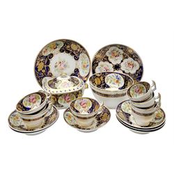 19th century New Hall tea wares, decorated in pattern no 2054, comprising three tea cups and three saucers, three coffee cups and three saucers, twin handled lidded sucrier, slop bowl, and two plates, decorated with floral sprays upon a cobalt blue border and heightened with gilt throughout

