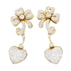 Pair of 18ct gold diamond heart and bow earrings, each stud with a heart shaped pendant, s...