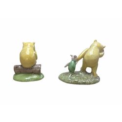 Two Royal Doulton Winnie the Pooh figures, the first 'Pooh and piglet - the windy day', and 'Under the name ''Mr Sanders''