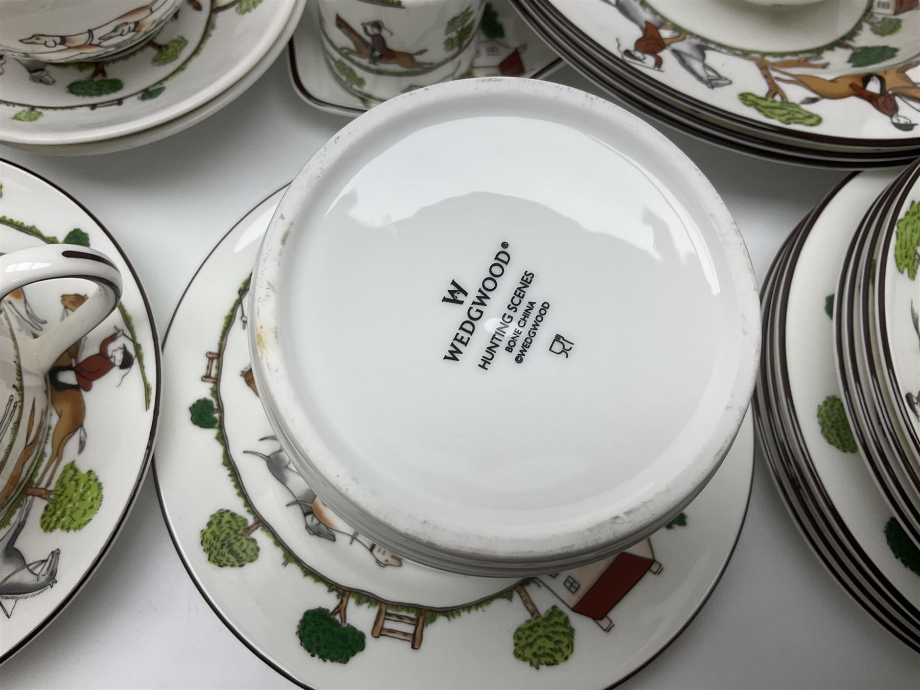 Wedgwood Hunting Scenes dinner and tea service for ten, to include dinner plates, side plates, dessert plates, cups and saucers, mugs, two large teapots, two milk jugs, etc, together with matching items by coalport and Staffordshire (94)