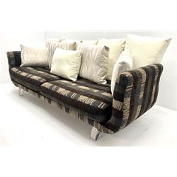 Grande four seat sofa upholstered in patterned fabric with contrasting scatter cushions 