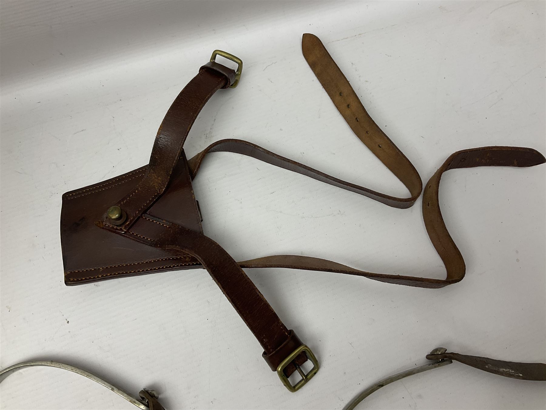 British Army General Staff officer's peaked cap by Herbert Johnson London in Moss Bros. delivery box; two officer's Sam Browne leather belts; leather pistol holster and sword hanger; pair of leather gloves and pair of spurs