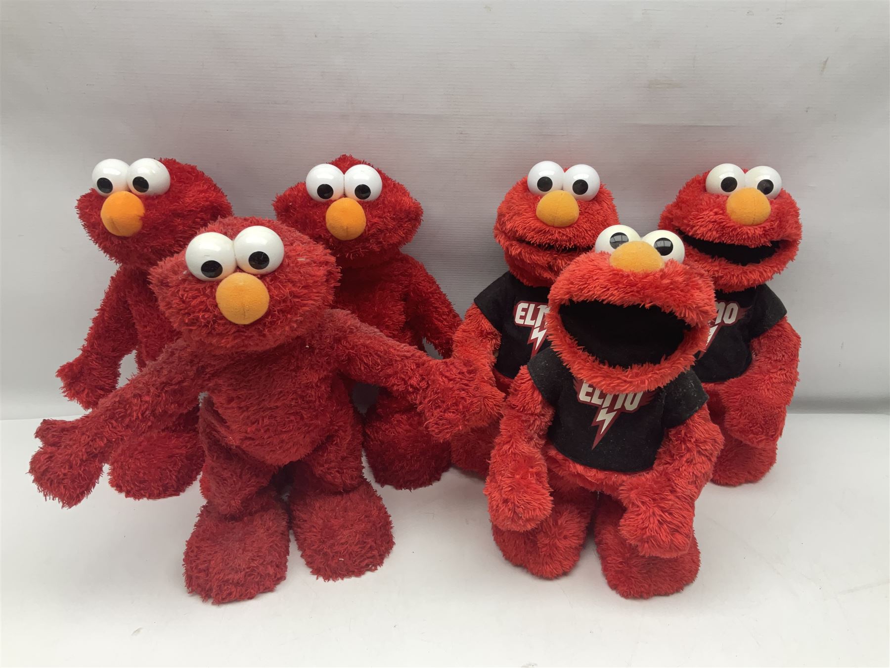 Collection of Sesame Street Elmo, together with Teletubbies and Disney toys etc in two boxes