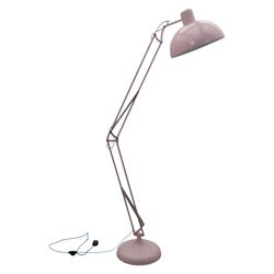 Contemporary pink floor lamp, in the manner of Anglepoise, counter balance sprung arm, blue cord with a weighted base 