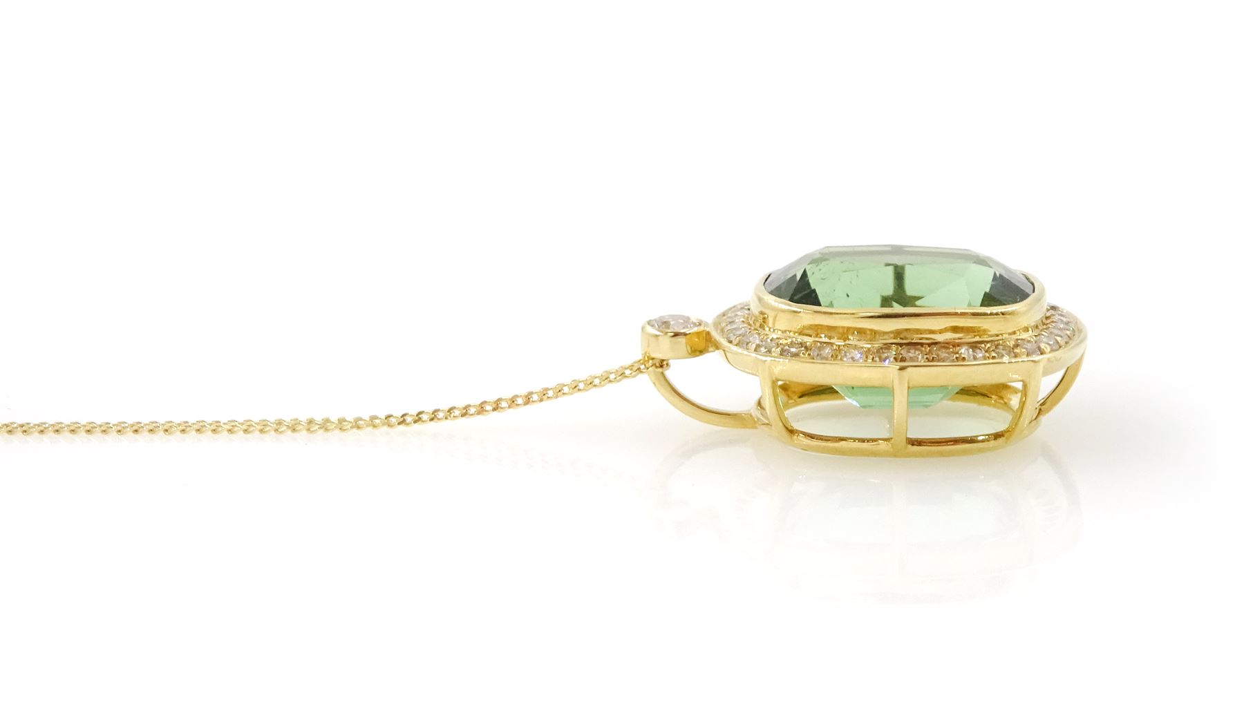 18ct gold green tourmaline and diamond pendant necklace, rectangular cushion cut tourmaline of approx 9.50 carat, surrounded by thirty-four round brilliant cut diamonds and a single stone diamond set bail, on a trace link chain necklace
