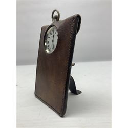 Early 20th century British Army officer's campaign clock in the form of a key-less wind nickel cased pocket watch with white dial, Roman numerals and subsidiary seconds dial, inscribed H. Williamson Ltd. London 9138F, the back with broad arrow and 9138F; in leather travelling case with dial aperture and brass easel support H14cm