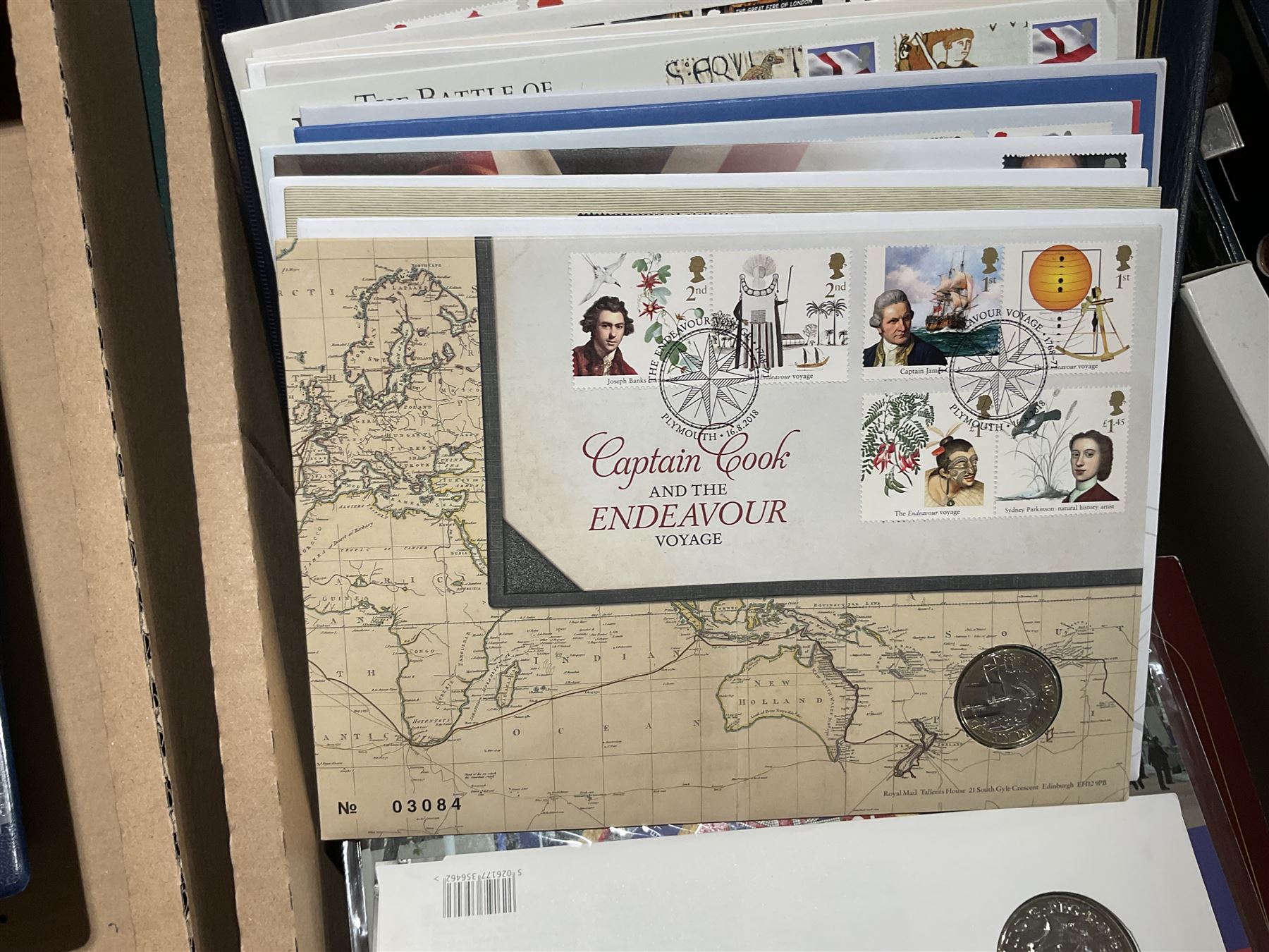 Approximately one hundred and fifteen Royal Mint coin covers, in two ring binder folders and loose, together with approximately 53 grams of Great British pre-1920 and approximately 68 grams of Great British pre-1947 silver threepence coins, and a small quantity of further pre-decimal coins