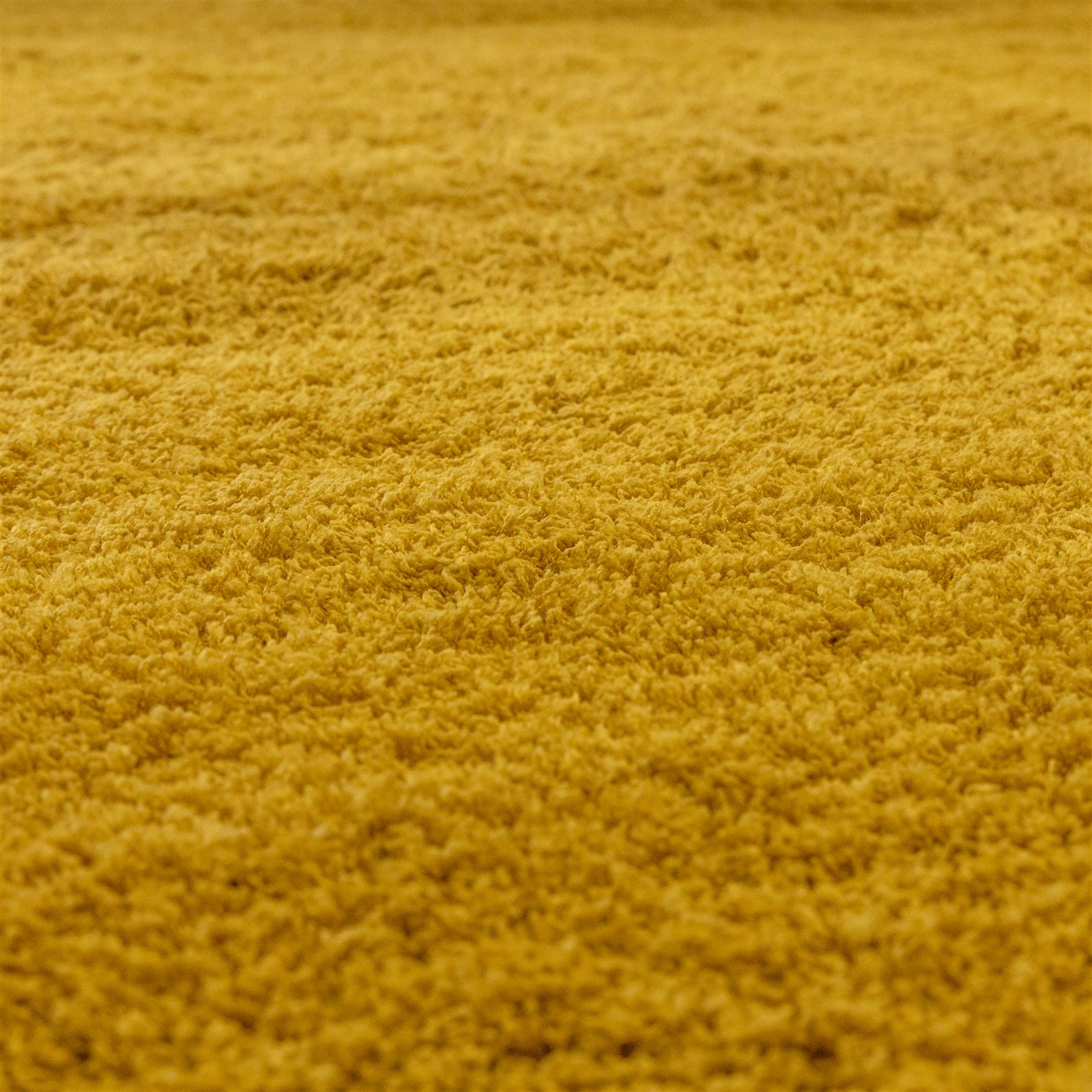 Next Home - large gold coloured cosy twist rug, polyester main with a cotton backing