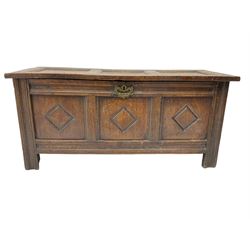 18th century oak chest or coffer, rectangular hinged top over moulded frieze rail, the three panel front carved with lozenges, raised on stile supports