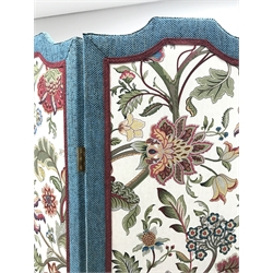 Three panel folding dress screen, upholstered with beige ground floral patterned fabric, W153cm, H181cm