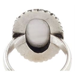 19th century French silver enamel portrait ring, set with an oval hand painted panel of a cherub, with split pearl surround