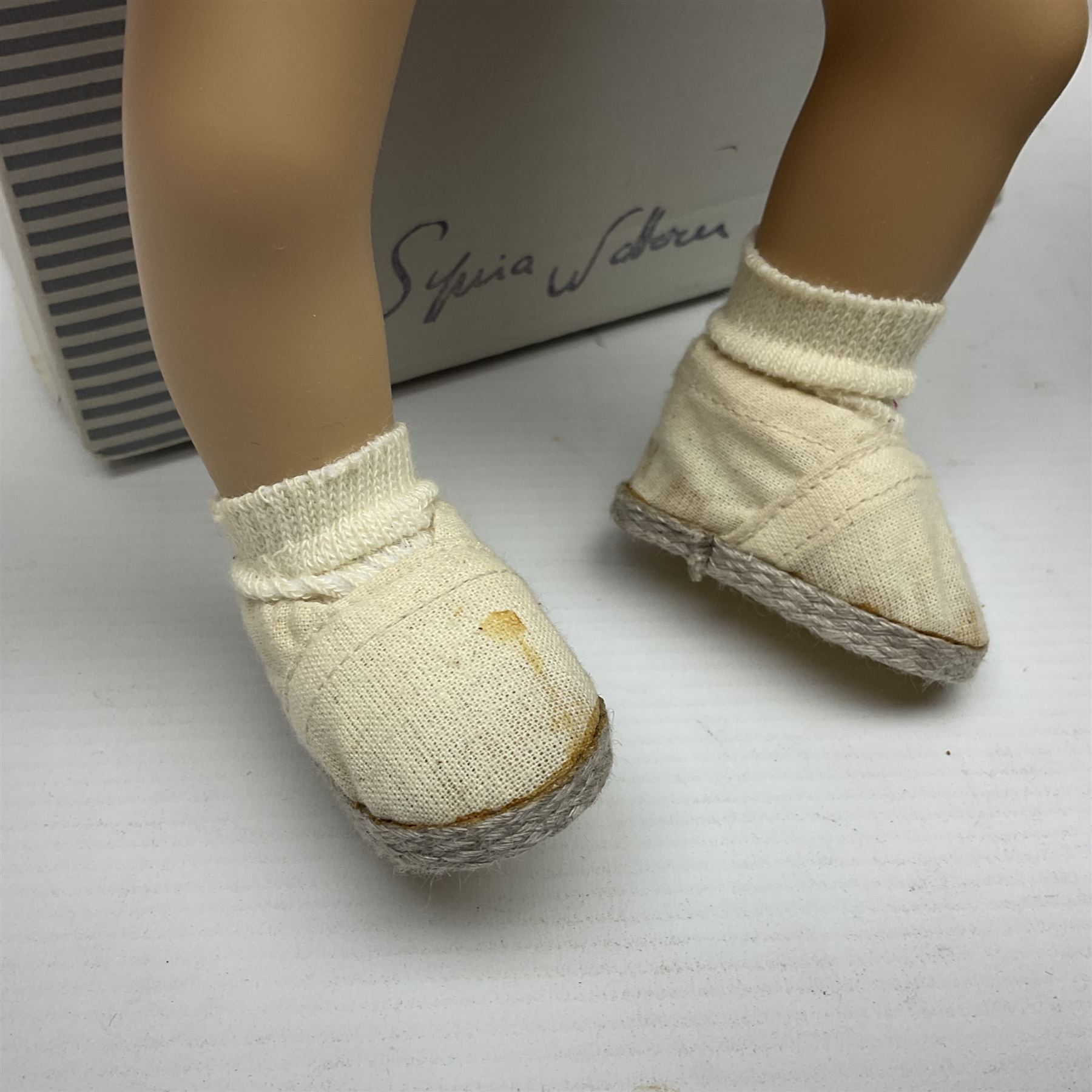 German Gotz articulated vinyl baby doll 'Claire' c1997 with original clothing, hat and labels; artist designed by Sylvia Natterer H35cm; boxed; and small child's wooden cased drum (2)