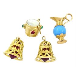 Three 18ct gold stone set pendant / charms including two bells and a jug and a 14ct gold mother of pearl and stone set drum pendant