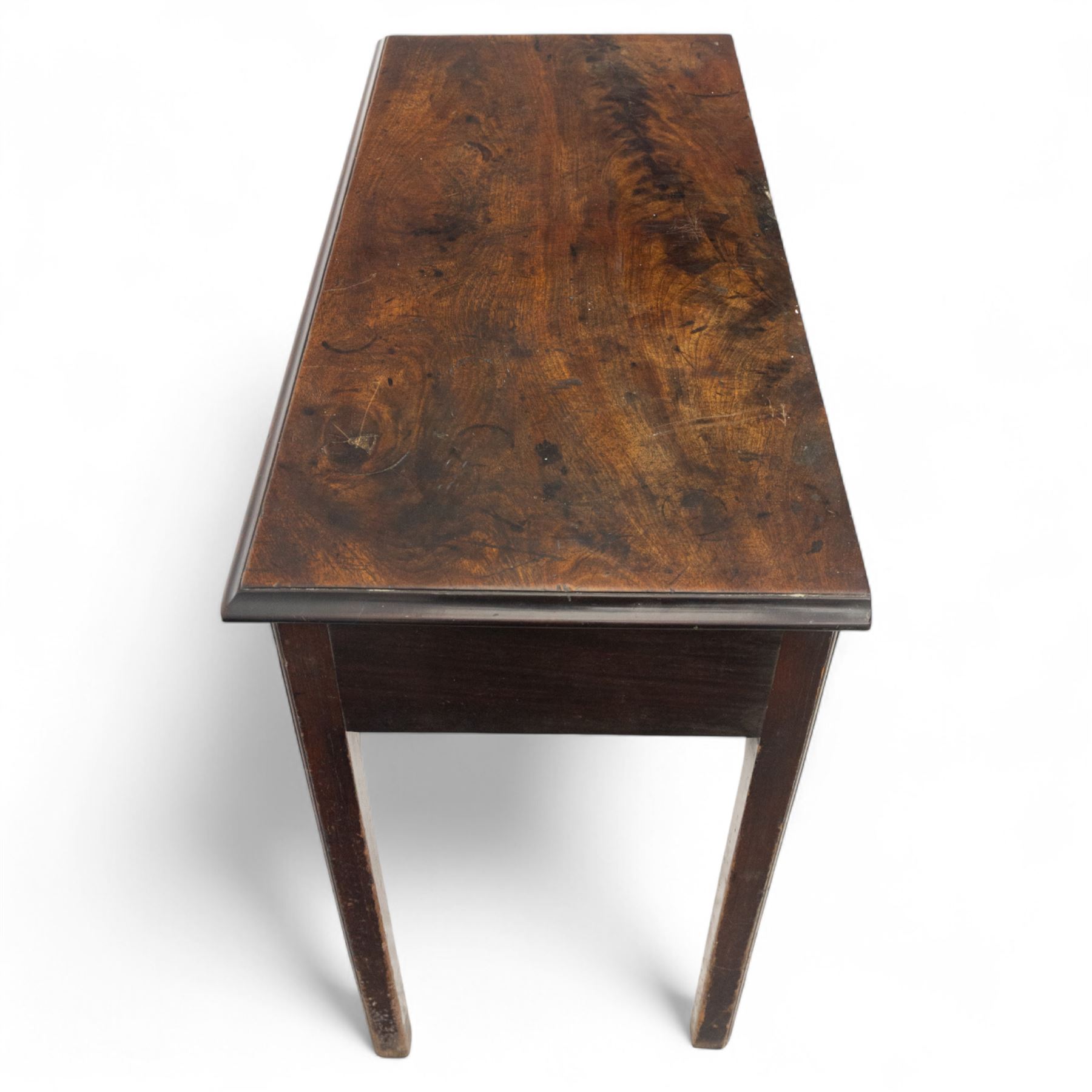 George III mahogany side table, the rectangular moulded top above a single frieze drawer fitted with brass swan neck handles, above a shaped serpentine apron raised upon square section legs, W86 D42 H75cm, together with a George III fretwork mirror, the rectangular plate within a gilt slip surmounted by a pierced crest with inset carved Ho-Ho bird, with shaped apron with gilt shell motif, H84cm W45cm