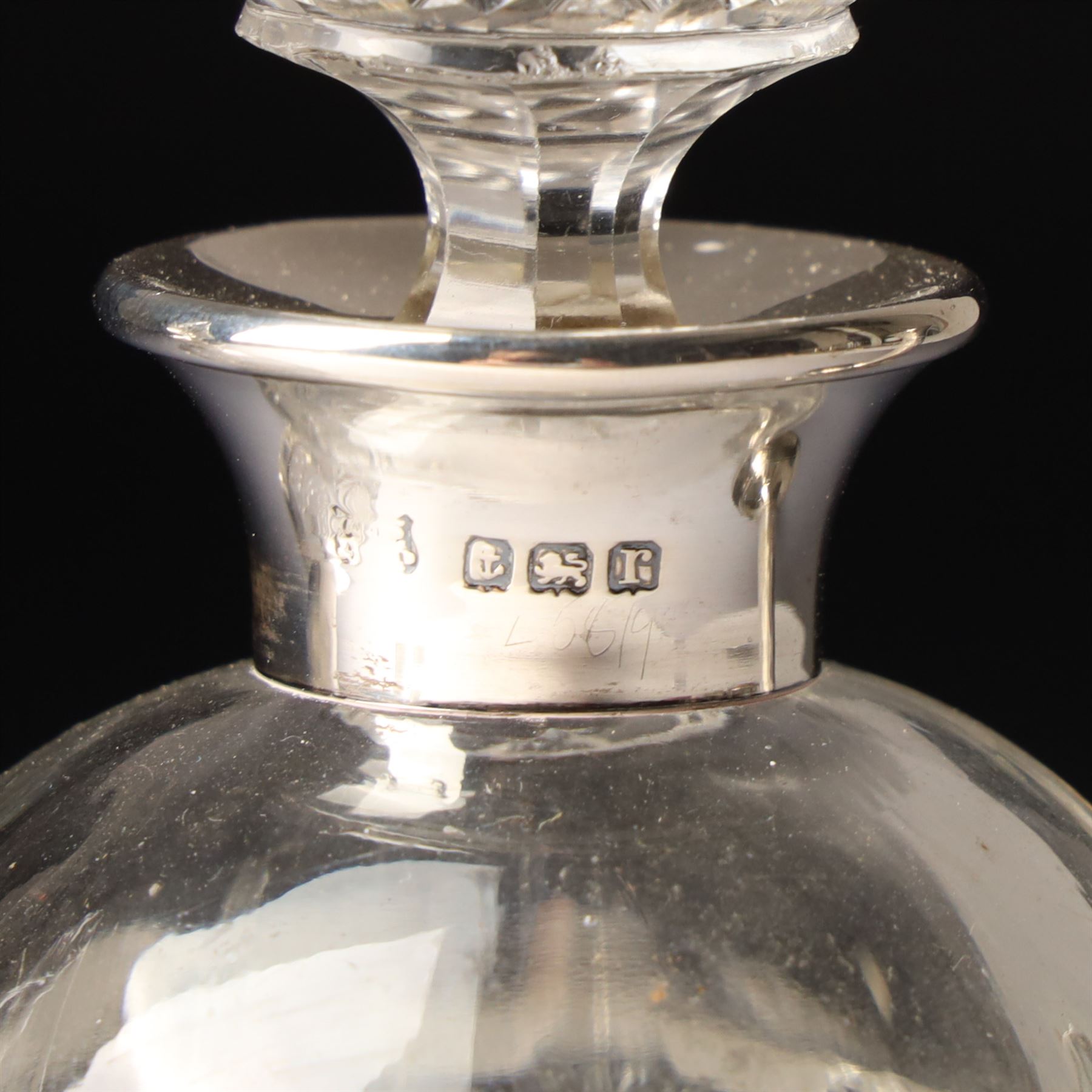 Silver upright photograph frame, aperture size 14cm x 9.5cm Birmingham 1919, pair of glass scent flasks with silver collars H16cm , two others, two dressing table jars with silver covers and a silver candlesticks