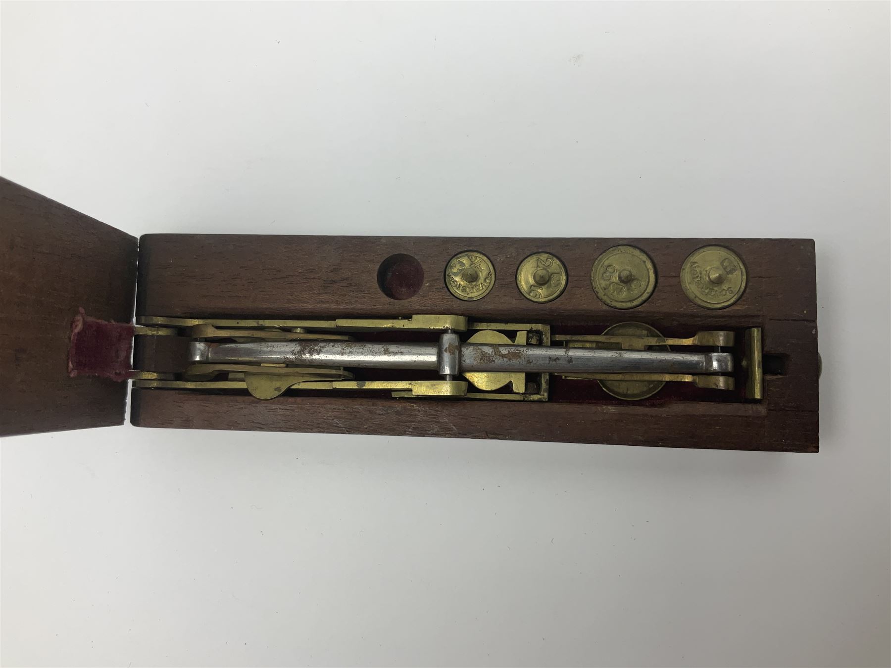 Brass sovereign scales and a part set of Georgian folding sovereign scales (one weight missing)