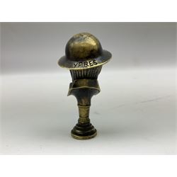 Bruce Bairnsfather 'Old Bill' style brass pipe tamper, the brim of the helmet inscribed 'YPRES' and the base 'WW1' H6.5cm
