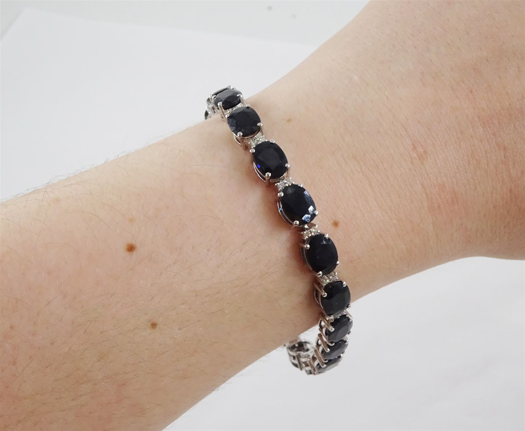 18ct white gold oval cut sapphire and round brilliant cut diamond bracelet, stamped, total sapphire weight approx 29.50 carat, total diamond weight approx 0.45 carat