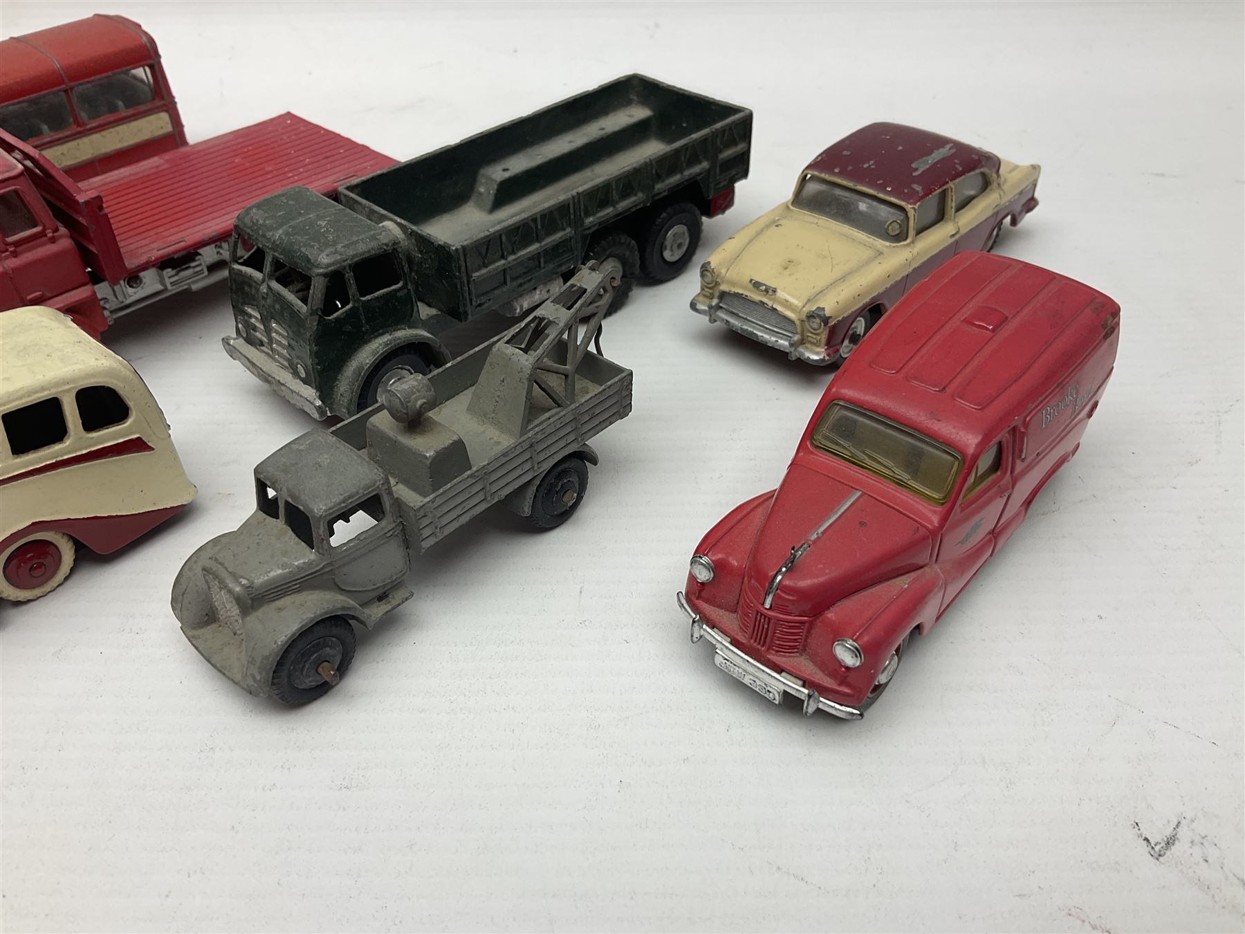 Dinky - sixteen unboxed and playworn die-cast models to include Single Deck Bus, two Atlantean Buses, Ford Transit Van, 10 Ton Army Truck, MGB Sports Car, Telephone Service Van etc 
