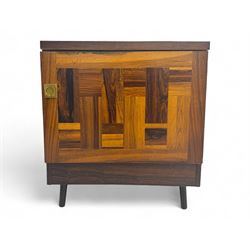 Troeds of Sweden - mid-20th century rosewood veneered cupboard, single door with brass handle enclosing interior fitted with one drawer, raised on ebonised tapered and splayed supports