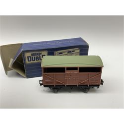 Hornby Dublo - twenty wagons including Cattle Trucks; Low-Sided Wagons; Cable Drum Wagons; Tank Wagon for Shell Lubricating Oil; Mineral Wagons; 20-Ton Bulk Grain Wagons; Goods Brake Vans; Furniture Containers etc; all in blue striped boxes (20)