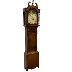 An eight-day longcase clock in an oak and mahogany case, retailed by the 19th century Cattaneo family of clockmakers in Stockton, with a swans neck pediment, central brass finial and brass paterae, break arch hood door flanked by two turned and ringed pilasters, trunk with a short twin spired oak door with mahogany crossbanding, on a tall rectangular plinth with a shaped base, fully painted break arch dial with matching spandrels and a depiction of a country cottage to the arch, with Roman numerals, minute track, seconds dial and stamped brass hands, movement striking the hours on a cast bell. With pendulum, key and one weight.    



