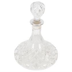 Two modern silver mounted glass decanters, the first a cranberry glass example, with fluted body, clear stopper and silver collar, hallmarked Barker Brothers Silver Ltd, Birmingham 2001, together with a clear cut glass example with silver collar, with import marks for London 1985, tallest H25.5cm