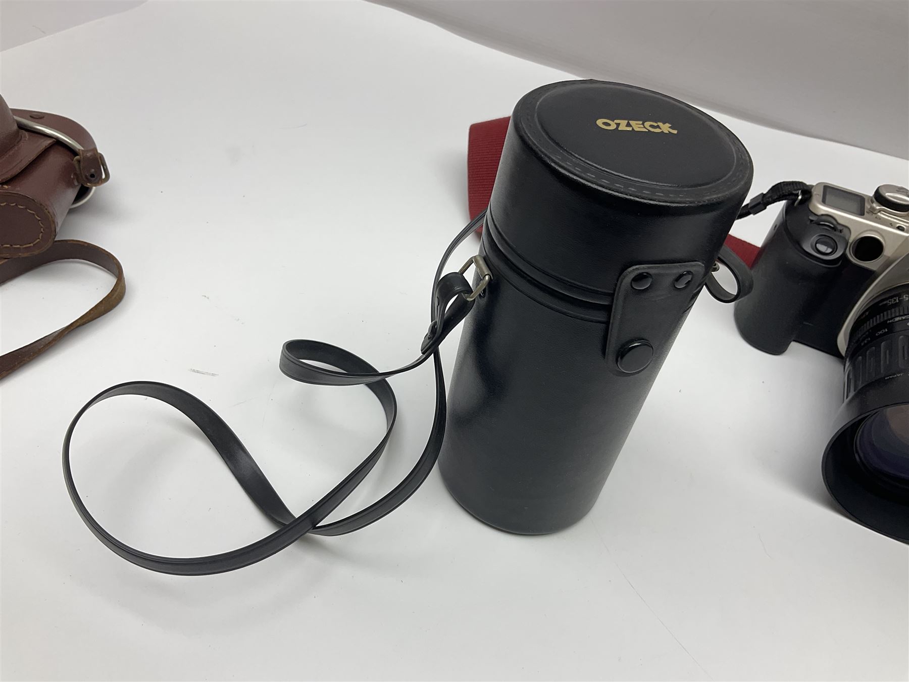 Canon EOS 50e camera body, serial no 8305671 with 'Canon Zoom EF 35-135mm 1:4-5.6' lens together with Halina 35X super camera body, with 'Halina Anastigmat f.c. 1:3.5 f=45mm' lens and other camera equipment 