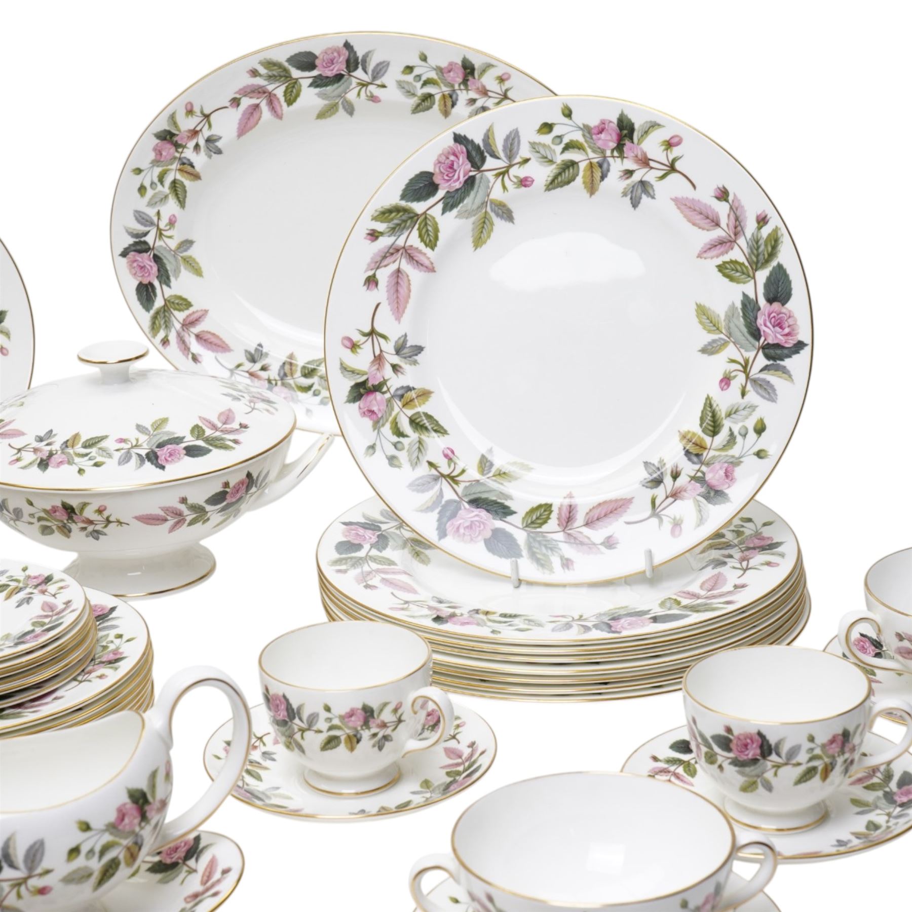 Wedgwood Hathaway Rose pattern tea and dinner wares, comprising two covered tureens, two oval serving dishes, eight dinner plates, eight dessert plates,  six side plates, eight soup bowls and stands, four teacups and saucers, and a sauce boat and stand