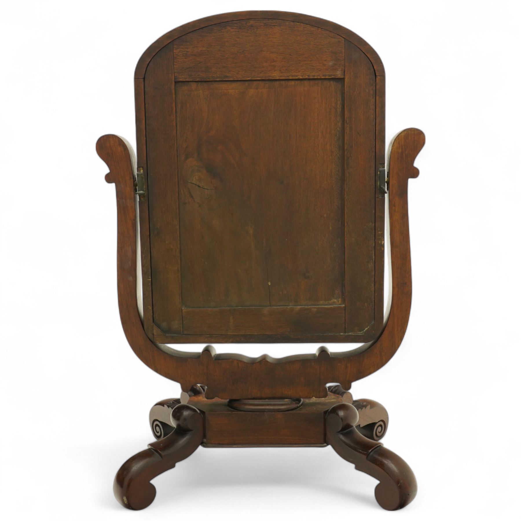 Ornate Victorian mahogany dressing table mirror, of rectangular form with rounded corners, mounted within a carved wooden frame with elaborate foliate scrolled supports, on scrolled feet 