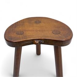 Mouseman - oak three-legged calf stool, kidney-shaped seat carved with the signature mouse motif, by the workshop of Robert Thompson, Kilburn