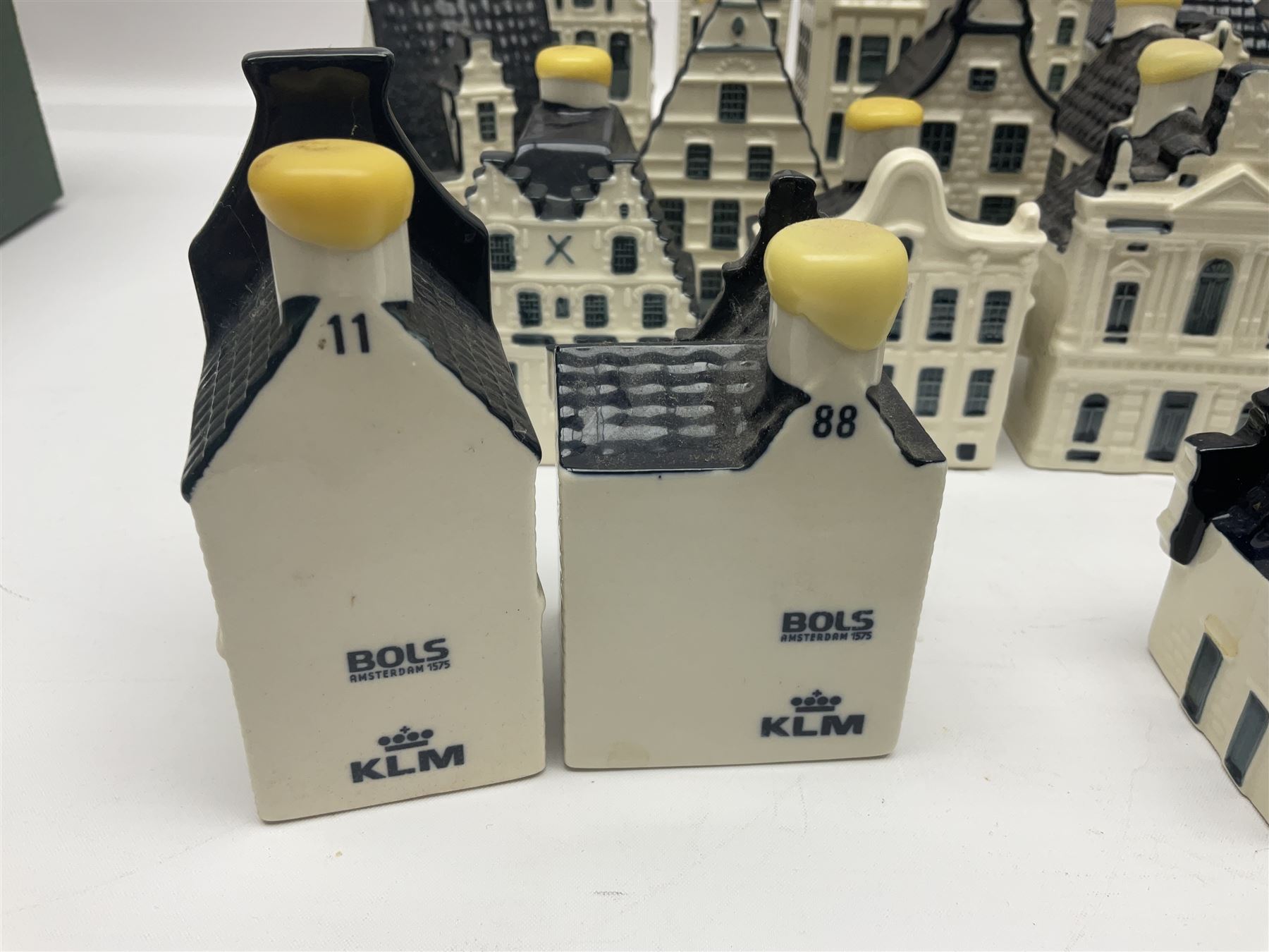 Twenty seven KLM Bols Blue Delft's decanters in the form of Dutch houses, some with contents