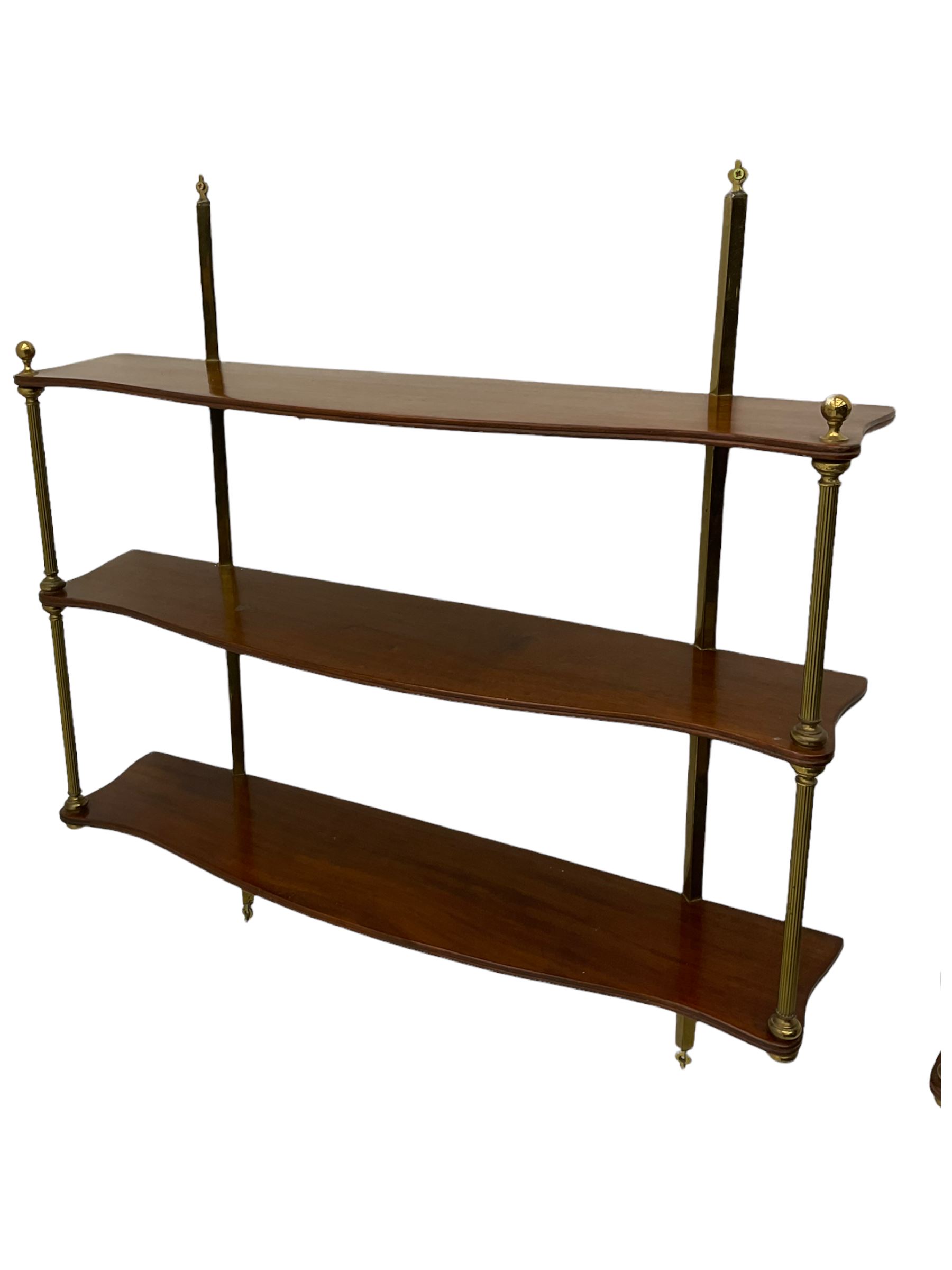 Pair of quality Regency design mahogany serpentine wall hanging shelves, three tiers, with cast brass fixtures, W77cm
