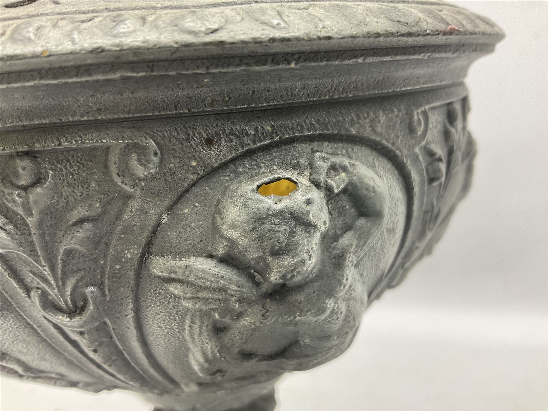 Victorian cast spelter oil lamp, decorated with cherubs and foliate scrolls, supporting a glass reservoir, burner and clear glass chimney, H62cm