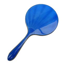 Art Deco thirteen piece silver mounted blue guilloche enamel dressing table set, comprising two hair brushes, two clothes brushes, hand mirror, two cut glass jars, buffer and a cut glass scent bottle, hallmarked J W Tiptaft & Son Ltd, Birmingham 1930 and 1932, and a silver handled manicure set, hallmarked Daniel Manufacturing Company, Birmingham 1930, with a pair of base metal scissors, each contained within three original fitted cases with black and cream silk and velvet lined interiors, one with removable mirror