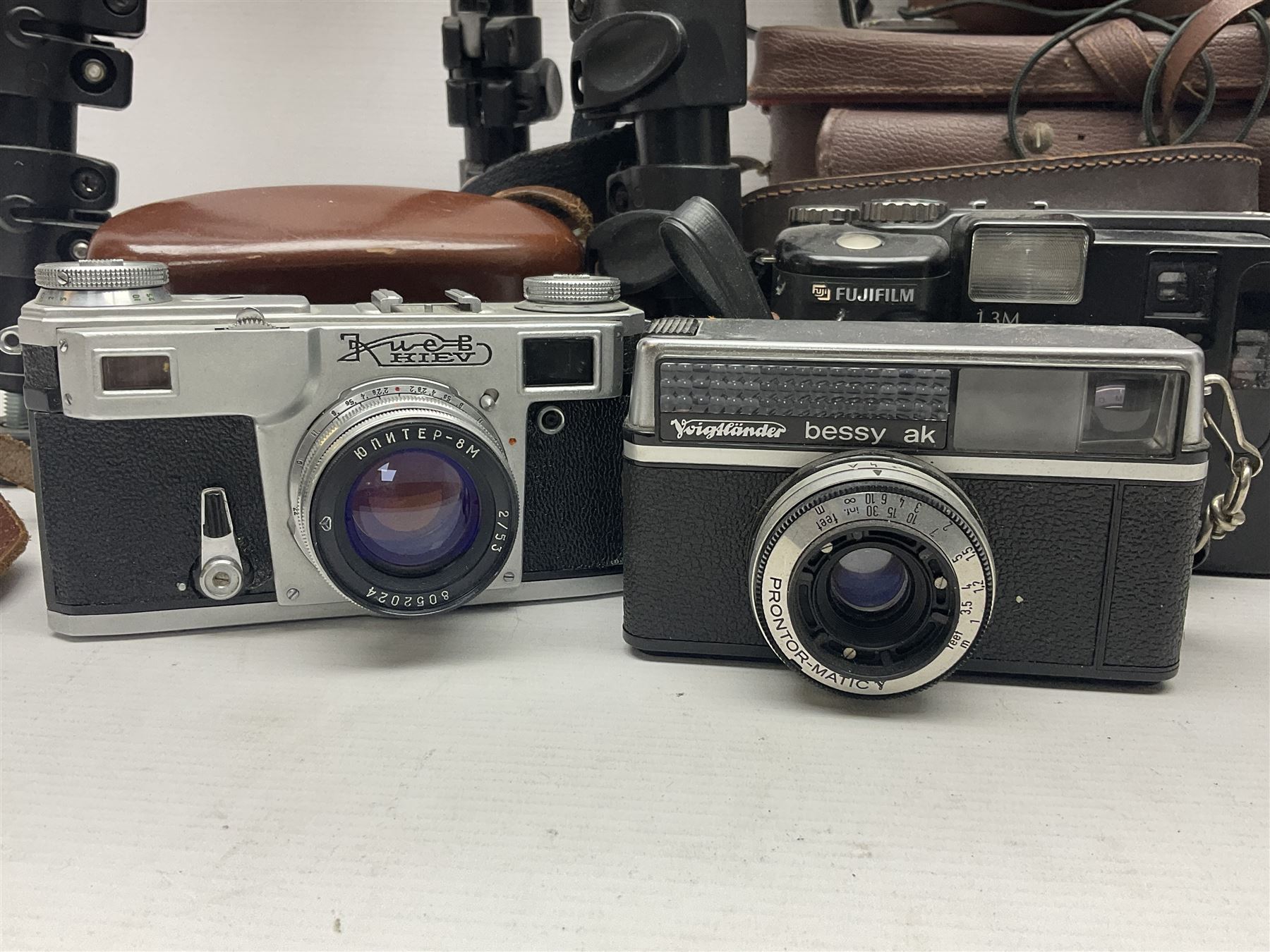 Collection of cameras and lenses, to include Pentax Program A camera body, serial no 123759, with 'Pentax-A zoom 1:3.5-4.5 28-80mm' len, Praktica EE2 camera body with 'Pentacon electric 1.8/50' lens etc, together with a Manfrotto tripod 