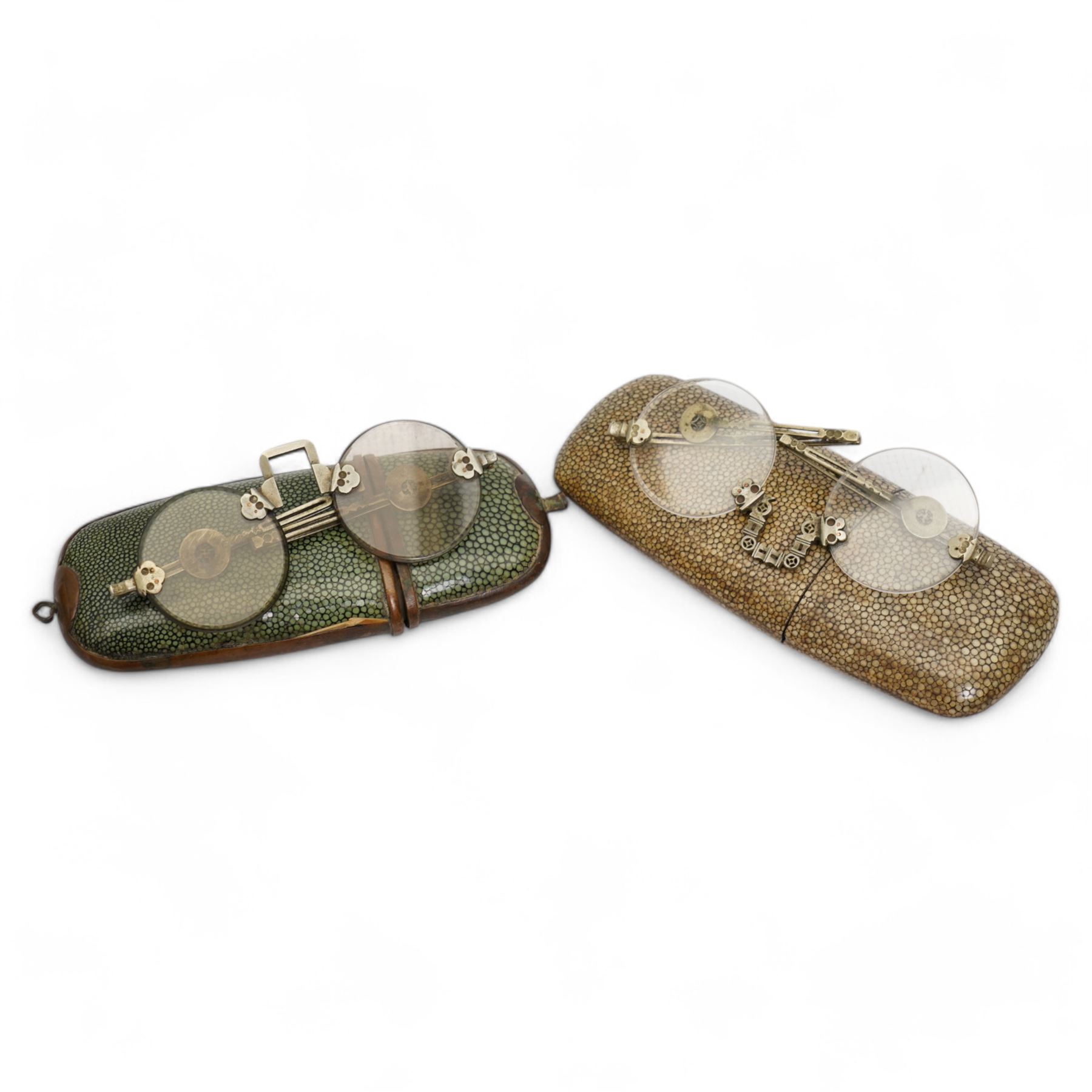 Two 19th century Chinese shagreen spectacle cases each containing a pair of nickel framed spectacles
