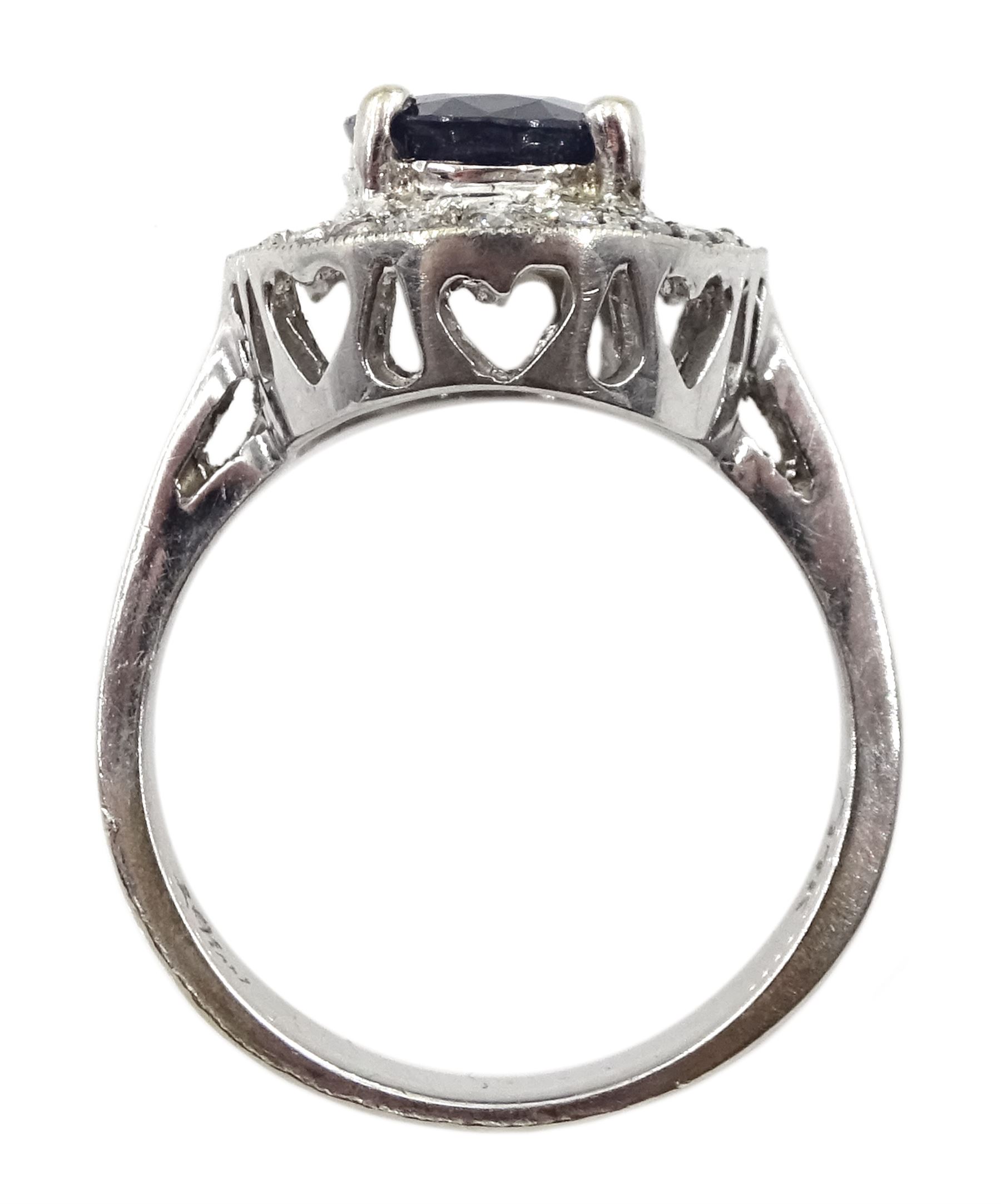 White gold oval sapphire and diamond cluster ring, stamped 14K, sapphire approx 2.00 carat