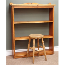  Pine open bookcase, three shelves, shaped solid end supports (W99cm, H121cm, D25cm) and a small stool (2)  