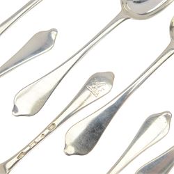 Twelve silver dog nose spoons, comprising a set of eight George II examples with drop heels  and engraved crest to terminals, hallmarked Isaac Callard, London 1732, three with rat tail bowls, circa 1722, hallmarked Samuel Hitchcock, London, date latter worn and indistinct, and a Britannia standard with rat tail bowl, circa 1718, each approximately L20cm